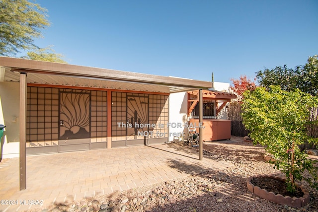 rear view of house with fence