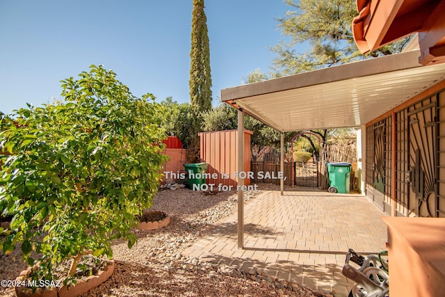 view of patio featuring fence