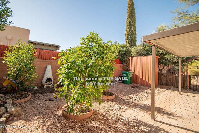 view of yard featuring a patio area and fence