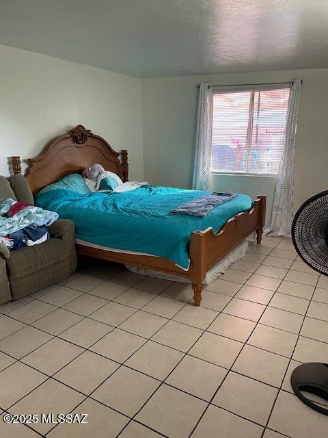 bedroom featuring light tile patterned floors