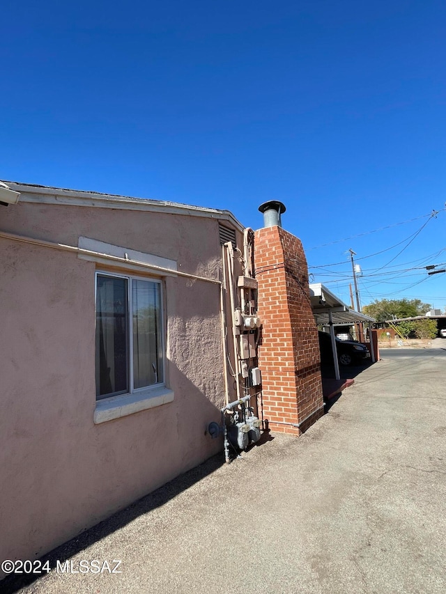 view of side of home featuring a patio area