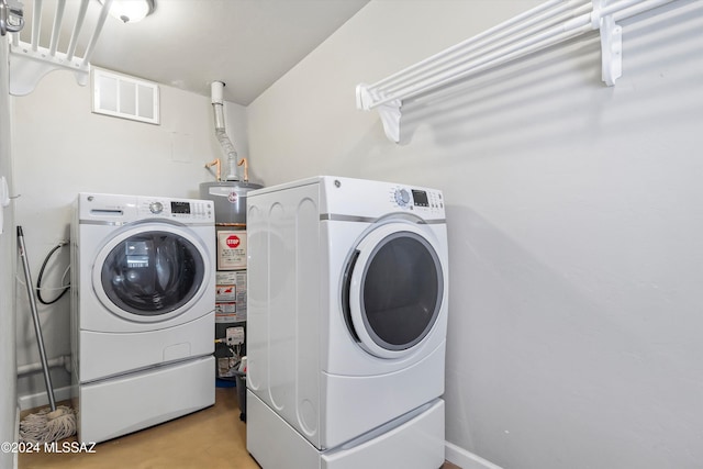 laundry room featuring washing machine and clothes dryer