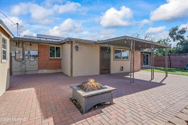 view of patio with an outdoor fire pit