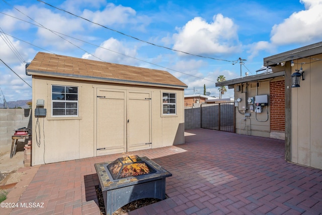 view of outdoor structure featuring a fire pit