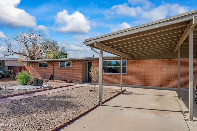 exterior space featuring a carport