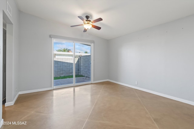 tiled empty room featuring ceiling fan and lofted ceiling