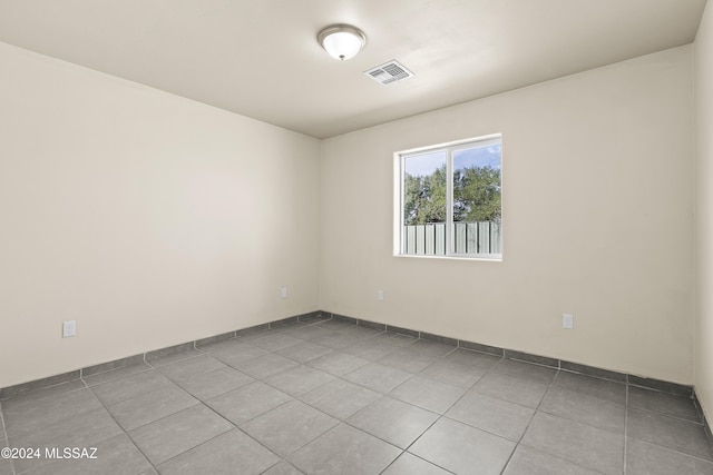 spare room featuring light tile patterned floors