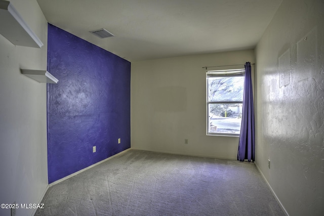 spare room featuring carpet flooring