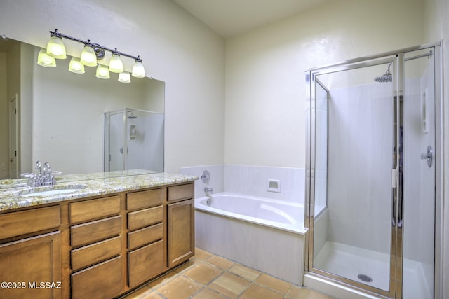 bathroom featuring tile patterned flooring, plus walk in shower, and vanity