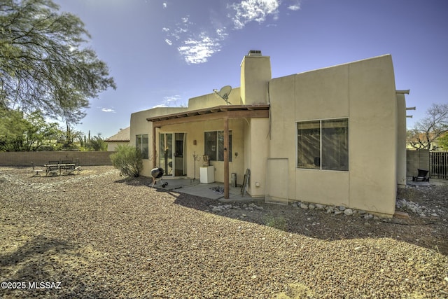 rear view of house with a patio