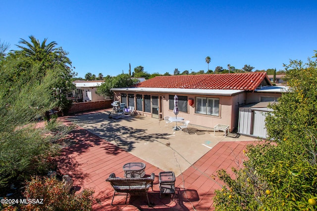 rear view of property with a patio area