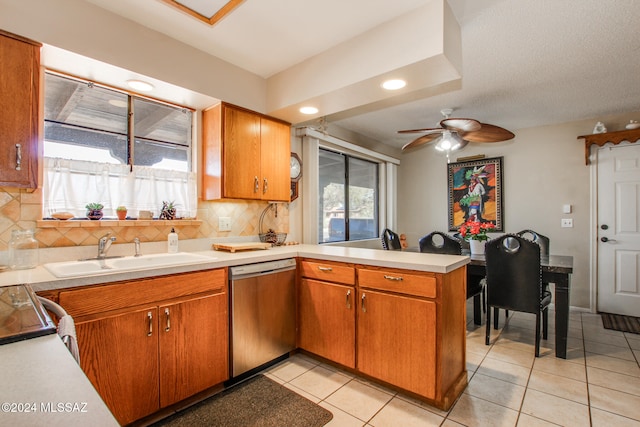 kitchen with dishwasher, ceiling fan, plenty of natural light, and sink