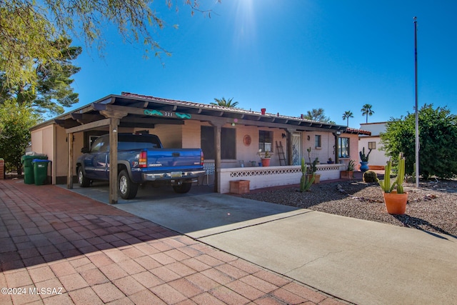 view of front of property featuring a carport