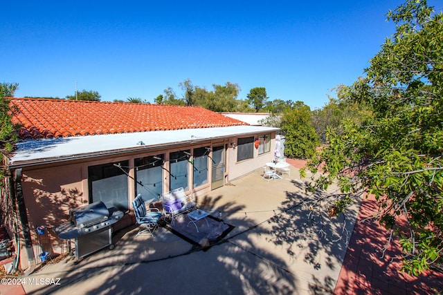 back of property featuring a patio