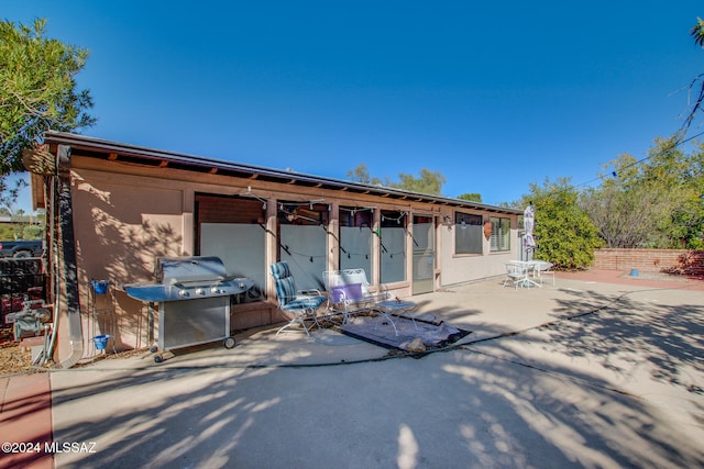 back of property featuring a patio