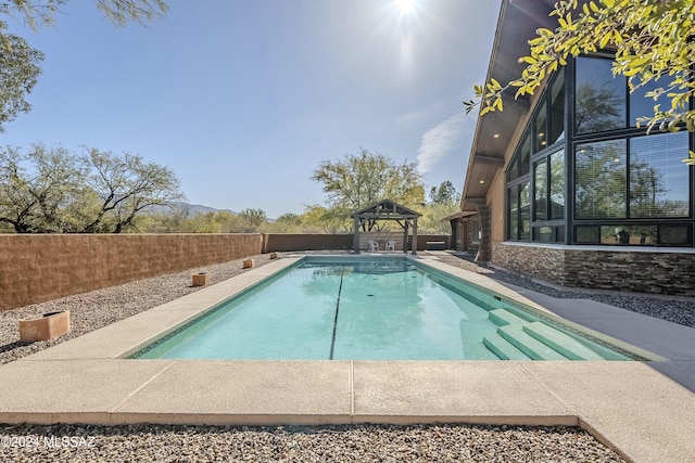 view of swimming pool with a gazebo