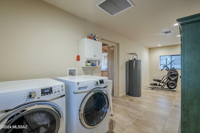 laundry room featuring separate washer and dryer and water heater