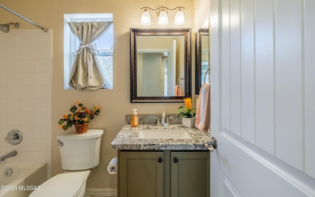 full bathroom with vanity, toilet, and tiled shower / bath