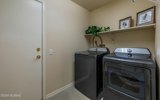 washroom featuring washer and clothes dryer