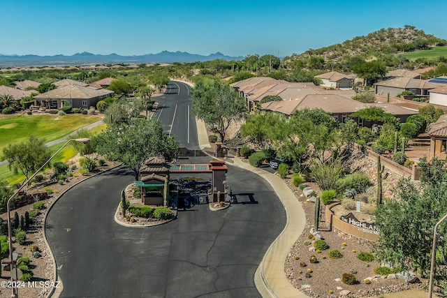 birds eye view of property with a mountain view