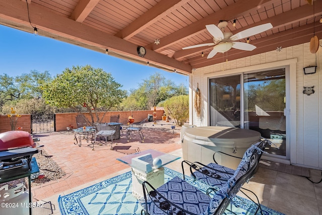 view of patio with ceiling fan and grilling area