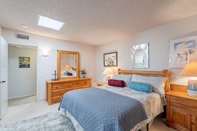 carpeted bedroom with a textured ceiling