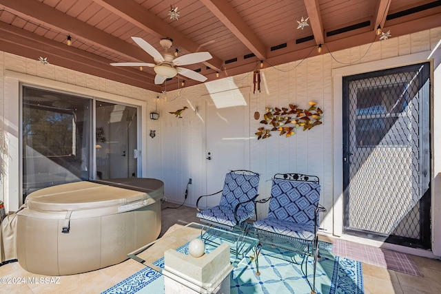 view of patio / terrace featuring a hot tub and ceiling fan