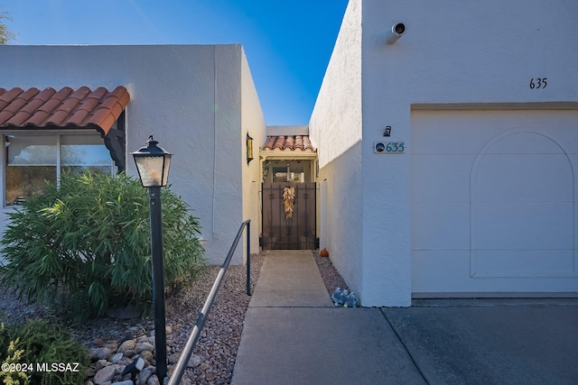 doorway to property featuring a garage