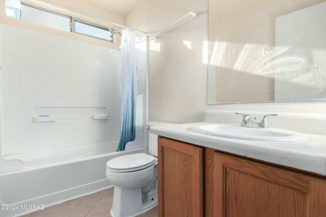 full bathroom featuring tile patterned floors, vanity, toilet, and shower / bath combo with shower curtain