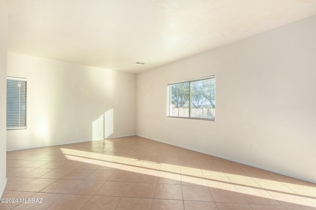 view of tiled spare room