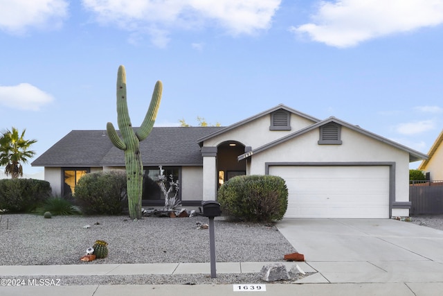 single story home featuring a garage