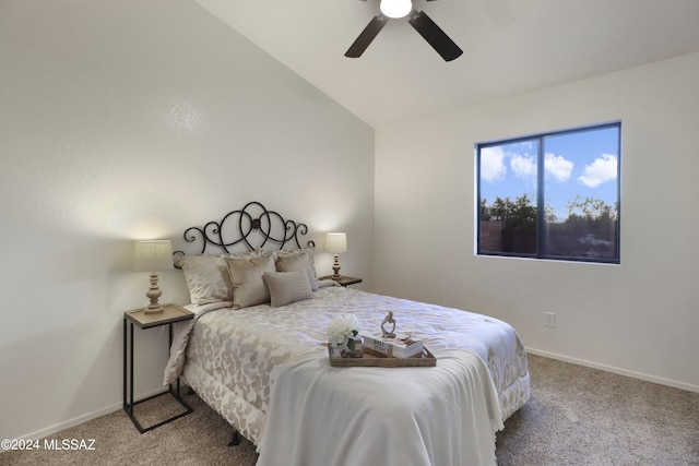 carpeted bedroom with ceiling fan and lofted ceiling