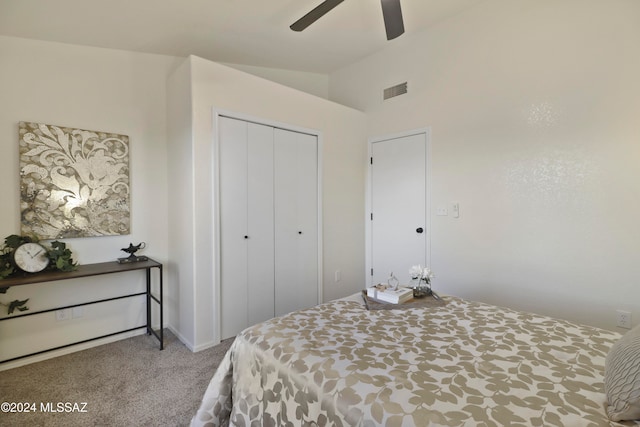 bedroom featuring ceiling fan, a closet, and carpet