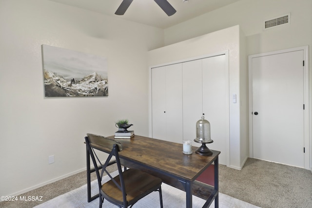 home office with ceiling fan and light colored carpet