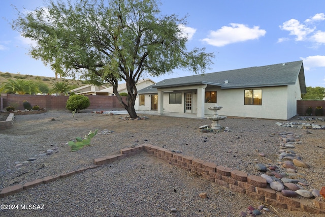 rear view of house featuring a patio