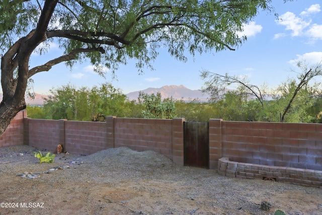 yard at dusk with a mountain view