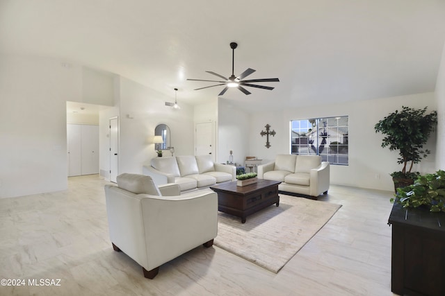 living room with ceiling fan and lofted ceiling