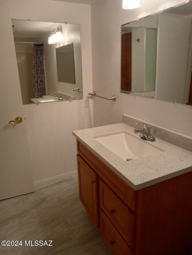 bathroom featuring vanity and walk in shower