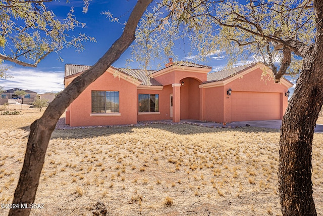 view of front of property with a garage