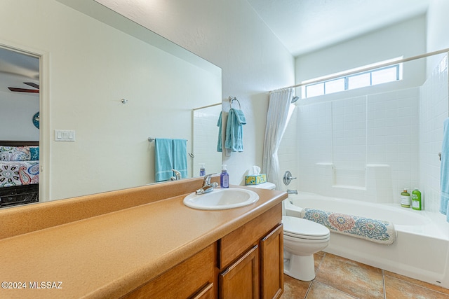 full bathroom with ceiling fan, tile patterned floors, toilet, shower / tub combo with curtain, and vanity