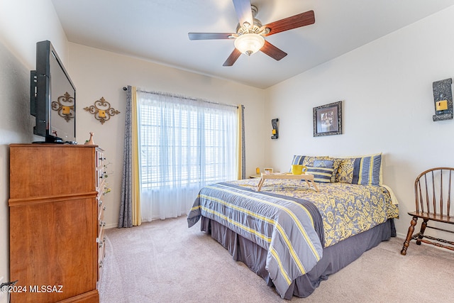 bedroom with light colored carpet and ceiling fan