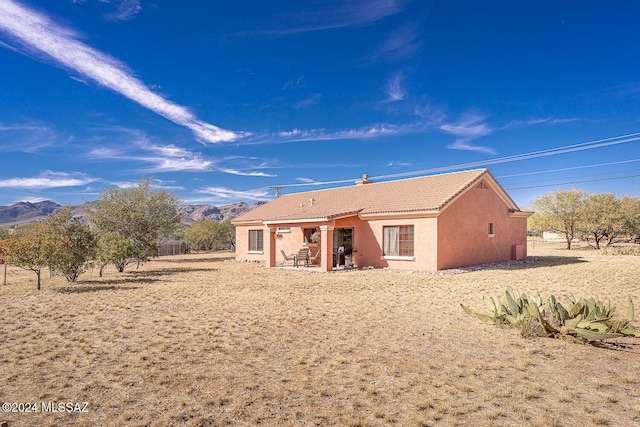 rear view of house with a mountain view