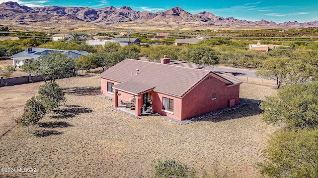 birds eye view of property featuring a mountain view