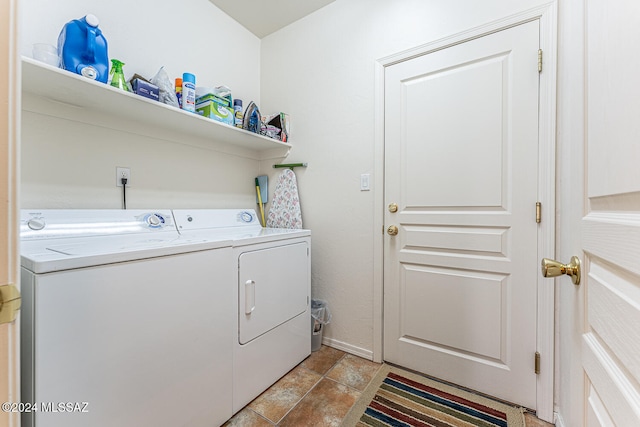 clothes washing area with washing machine and dryer