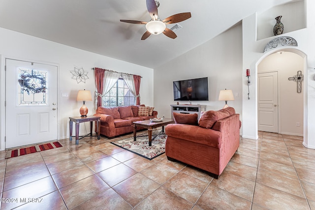 living room with ceiling fan, light tile patterned floors, and high vaulted ceiling