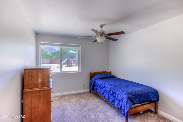 carpeted bedroom with ceiling fan