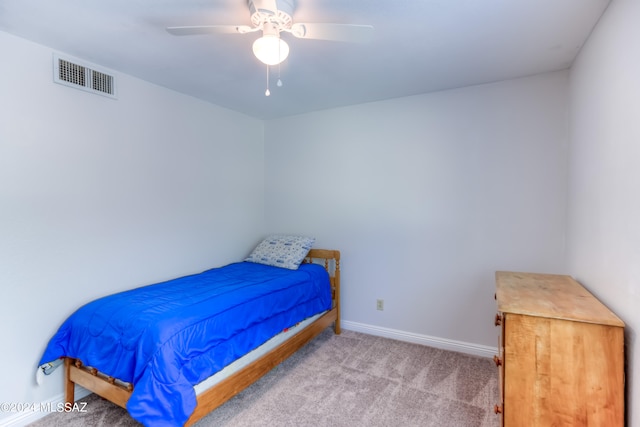 carpeted bedroom with ceiling fan