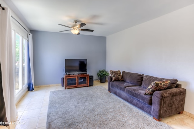 tiled living room featuring ceiling fan