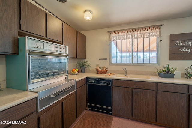 kitchen featuring dishwasher, oven, light countertops, dark brown cabinets, and a sink