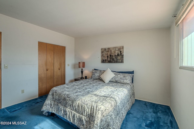 carpeted bedroom with a closet